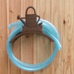 RECOGEMANGUERAS METAL REGADERA